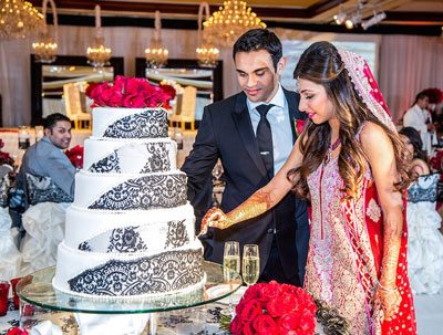 cutting cake at Indian wedding